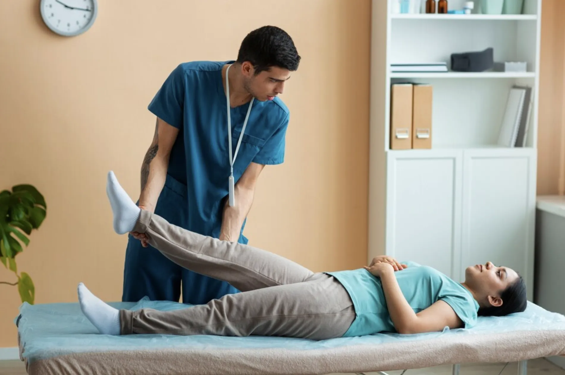 Physiotherapist guiding an employee through exercises